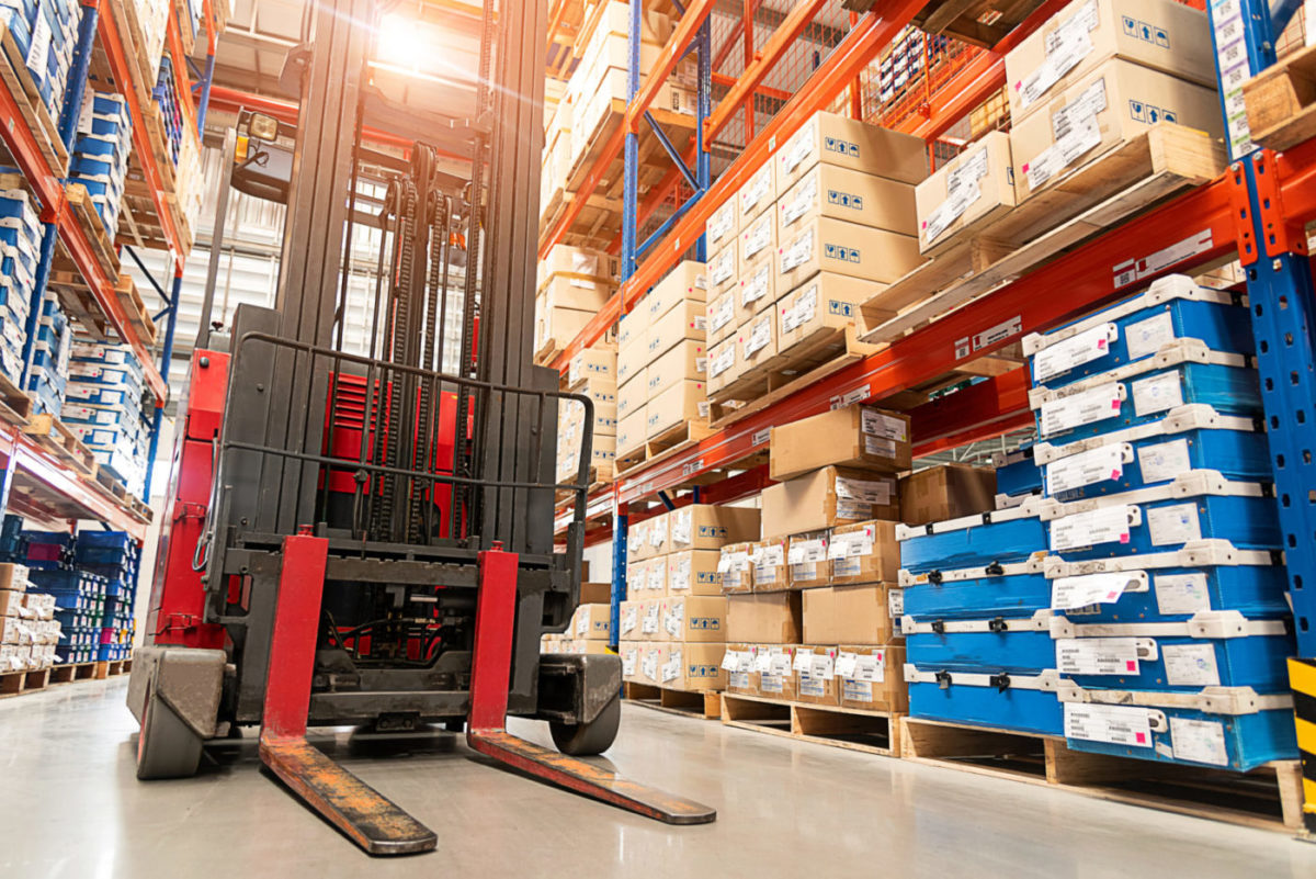 Forklift truck loader. Huge distribution warehouse with high shelves background.